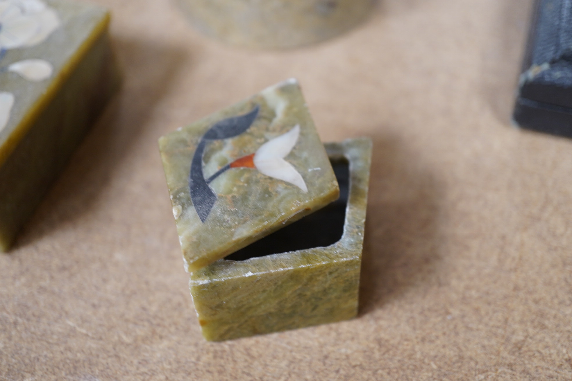 A group of assorted Indian soap stone pietra dura floral inlaid boxes, largest 10.5cm wide. Condition - good